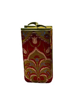 A small rectangular glasses case with a red and gold brocade pattern, featuring a gold metal frame and clasp closure, 
