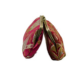 A small, rounded coin purse made of pink brocade fabric with gold and silver floral patterns, featuring a gold-tone metal clasp frame, 