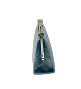 A small structured coin purse shown from the side. The purse has a glossy light blue background with silver circles - prominent silver-toned metal trim and frame details.