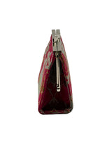 A small triangular clutch purse with a silver metal kiss-lock closure, featuring a deep magenta-pink brocade fabric with gold and silver patterns, shown from a side profile view on a light gray background.